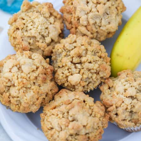 Banana Crumb Muffins on a plate, shot from overhead.